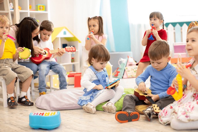 teacher and children at preschool