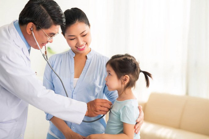 a doctor is examining a child